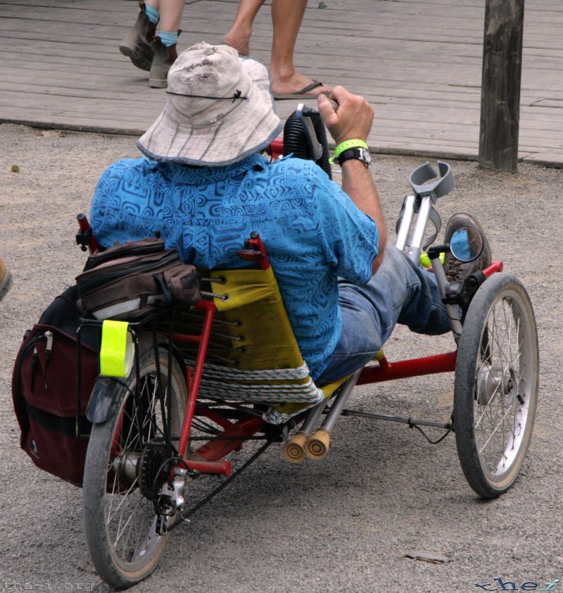 Man in hand-powered wheel chair