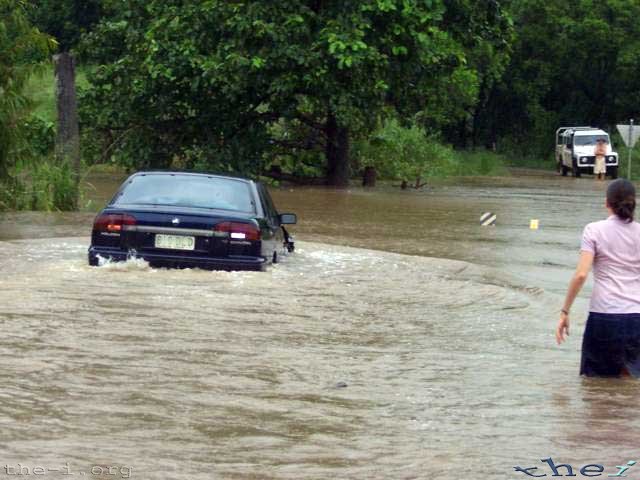 Car crossing flooded road